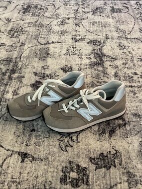 Silver and white new balance shoes